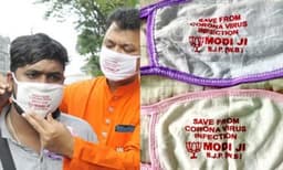 മുകളില്‍ എഴുത്ത്  ‘സേവ് ഫ്രം കൊറോണ വൈറസ്/മോഡി ജി/ ബിജെപി’ ; ബംഗാളില്‍ കോവിഡ് 19 പ്രതിരോധിക്കാന്‍ നല്‍കിയ മാസ്‌ക്കും പ്രചരണ ആയുധമാക്കി ബിജെപി  