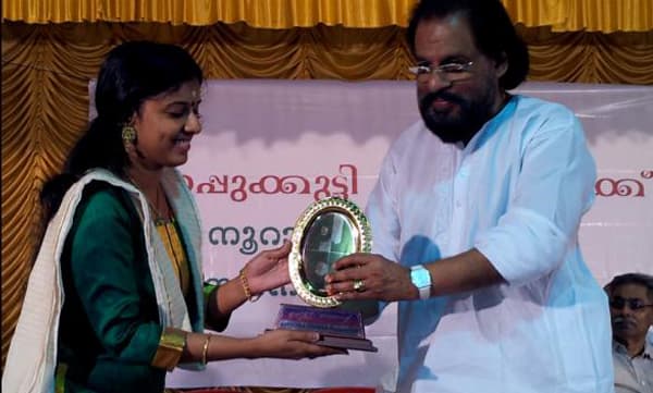 Singer Sithara Krishnakumar receiving award from K.J. Yesudas (Image Source : Facebook)