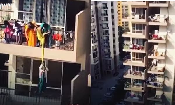 Mother ties son from 9th floor balcony to 8th floor to pick clothes (Image Source: Facebook)