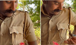 പൊലീസുകാരനുമായി കൂട്ടുകൂടാനെത്തിയ കിളി; വീഡിയോ വൈറല്‍