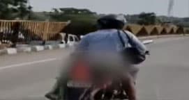 അമിതവേഗതയില്‍ ട്രക്ക് ഇടിച്ചു ഭാര്യ മരിച്ചു ; സഹായത്തിന് നിലവിളിച്ചിട്ട് ആരും വന്നില്ല ; മൃതദേഹം ബൈക്കില്‍ കെട്ടി യുവാവ്