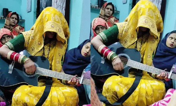 മുഖംമറച്ച് ഗിറ്റാര്‍ വായിച്ച് പാട്ടുപാടുന്ന നവവധു: അനുകൂലിച്ചും പ്രതികൂലിച്ചും നെറ്റീസണ്‍സ്
