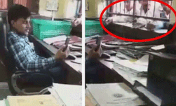 മുന്നില്‍ അക്ഷമരായി ക്യൂ നില്‍ക്കുന്ന ആളുകള്‍: കസേരയില്‍ ഇരുന്ന് വീഡിയോ കോളില്‍ മുഴുകി സര്‍ക്കാര്‍ ഉദ്യോഗസ്ഥന്‍, വീഡിയോ 
