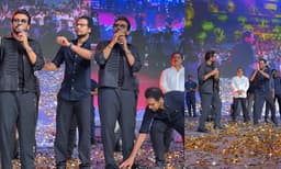 Director Venky Atluri pays respect to Suriya on stage (Image Source: Instagram)