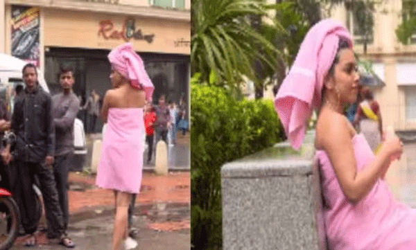 എന്തൊക്കെ കാണണം: ടവ്വല് മാത്രം ധരിച്ച് തിരക്കേറിയ റോഡിലൂടെ നടക്കുന്ന യുവതി, കണ്ണ് തള്ളി യാത്രക്കാര്