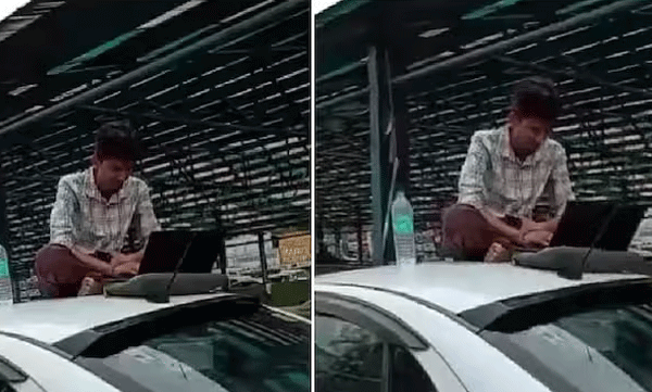 വെള്ളക്കെട്ടിൽ കാബ് കുടുങ്ങി; മുകളില് ലാപ്ടോപ്പുമായി കയറി ജോലി ചെയ്ത് യുവാവ്, പുതിയ വര്ക്ക് ഫ്രം ഹോമെന്ന് നെറ്റീസണ്സ്
